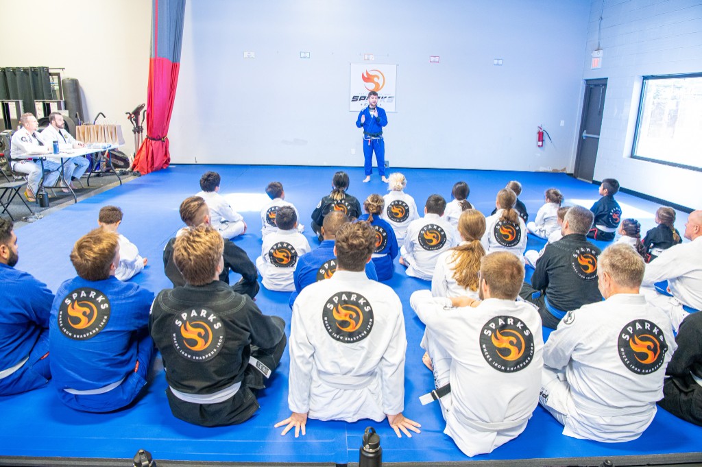 Belt test with students lined up on the mats