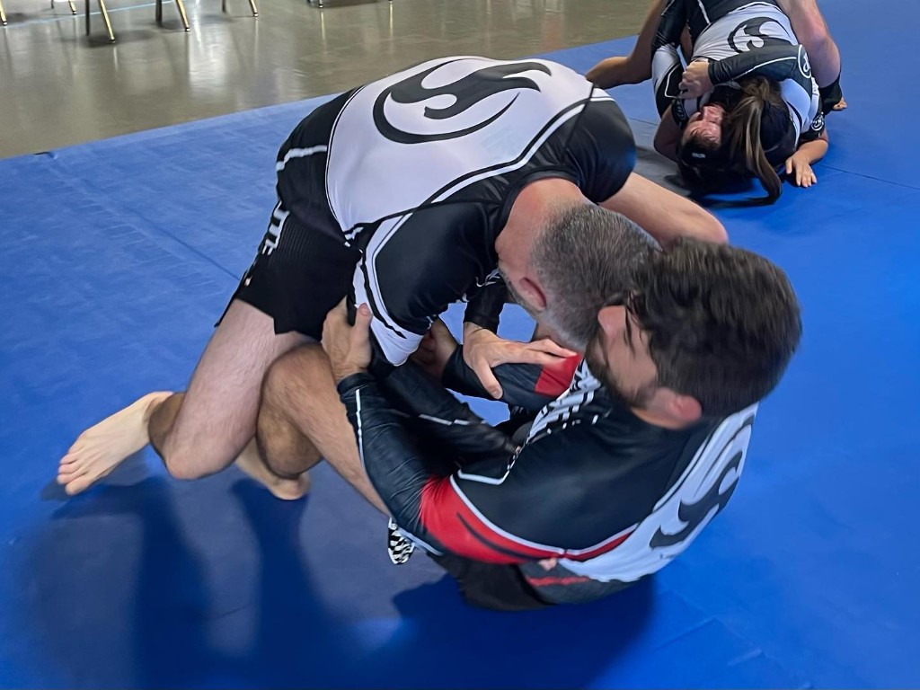 Students rolling during BJJ training
