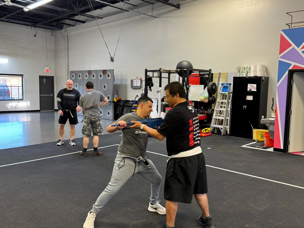 Weapons training on the gym floor
